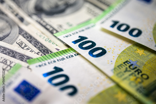 100 dollar bills and 100 euro bills close-up symbolize wealth, international finance, currency exchange and world economy, world currency market, competitors