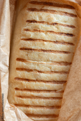 Panini bread in a brown paper bag. Eco friendly recycle disposable sustainable packaging photo