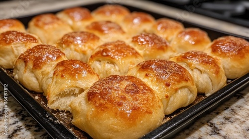 Golden Brown Homemade Bread Rolls on Baking Tray photo