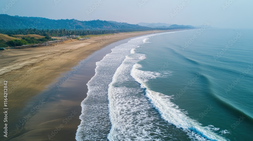Fototapeta premium Serene Aerial View of Tranquil Beach and Gentle Waves at Dusk