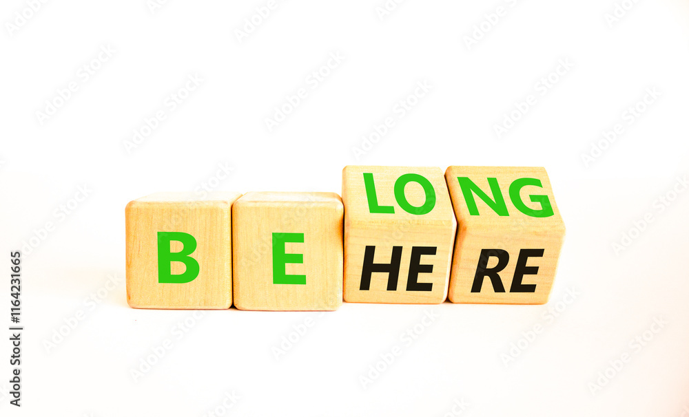 Belonging and belong symbol. Concept words Be here Belong on beautiful wooden block. Beautiful white table white background. Business motivational belonging and belong concept. Copy space. Belonging and belong symbol. Concept words Be here Belong on beautiful wooden block. Beautiful white table white background. Business motivational belonging and belong concept. Copy space.
