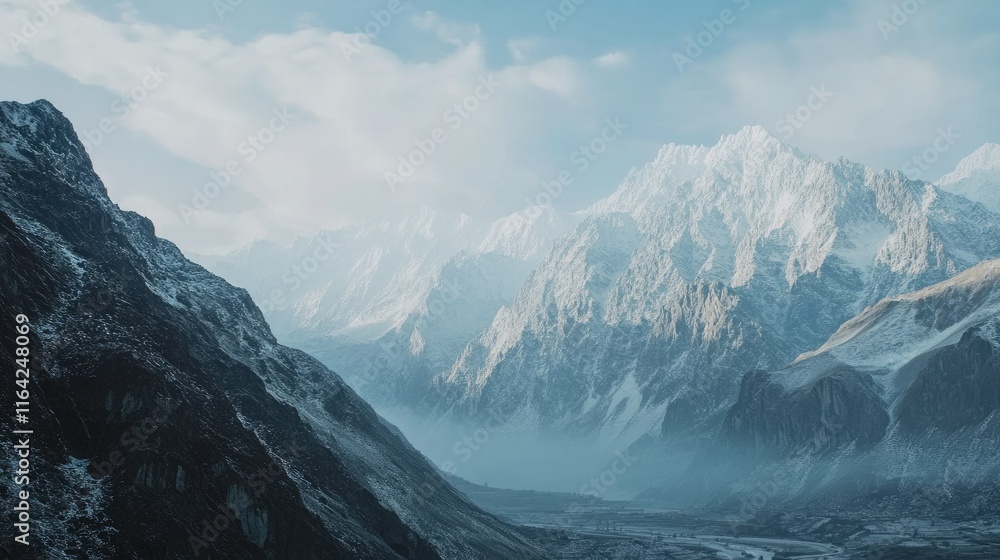 Majestic Snow-Capped Mountains with Serene Blue Sky and Clouds Majestic Snow-Capped Mountains with Serene Blue Sky and Clouds