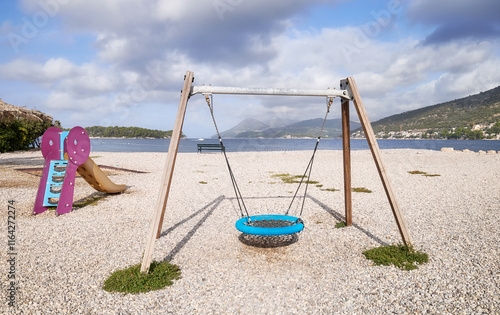 Swing on a rocky beach. photo