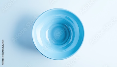 Top View Of Blue Ceramic Plate On White Background  - A Stylish And Elegant Dining Option For Any Table Setting. photo