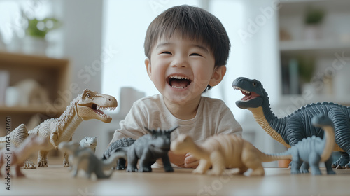 4 years old asian kid laughing while playing with dinosaurs toys at home photo