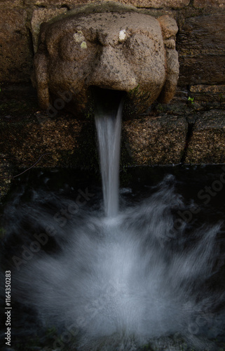 An ancient well at St Petroc's Church Bodmin Cornwall photo