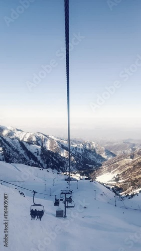 Flying over the winter magic! The gondola of the cable car descends smoothly, revealing breathtaking panoramic views of the ski resort.  Kazakhstan. Alma Ata. The Cimbulac Resort. 29.12.24