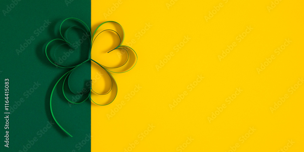 Festive banner with decorations for St. Patrick's Day. Four-leaf clover paper art. St. Patrick's Day composition on yellow and green background. Top view. Flat lay. Festive banner with decorations for St. Patrick's Day. Four-leaf clover paper art. St. Patrick's Day composition on yellow and green background. Top view. Flat lay.