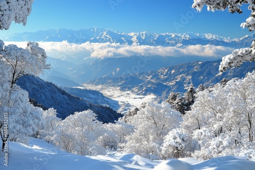 Majestic snow-covered mountain range under clear blue sky in a serene winter ...