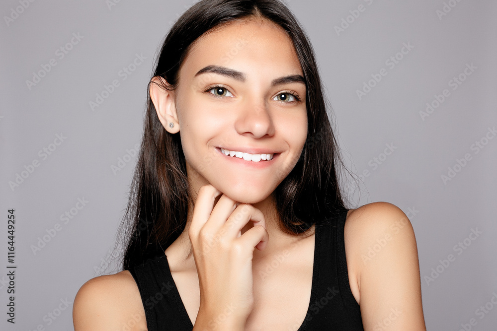 Portrait of a smiling attractive looking at the camera. Portrait of a smiling attractive looking at the camera.