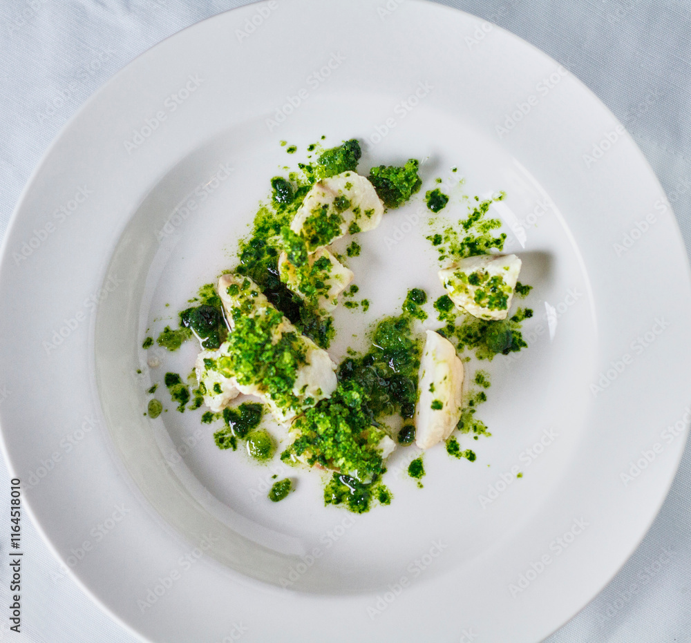fresh poached fish bites topped with basil pesto fresh poached fish bites topped with basil pesto