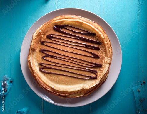 Assiette gourmande de crêpes avec un nappage chocolat pour la chandeleur en février photo