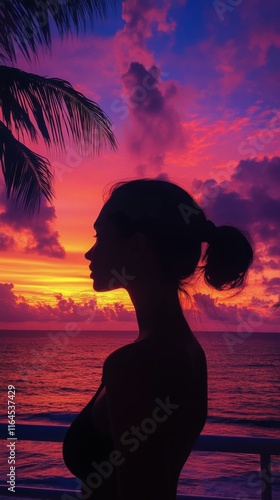 Woman enjoying a colorful sunset by the beach with palm trees in the background