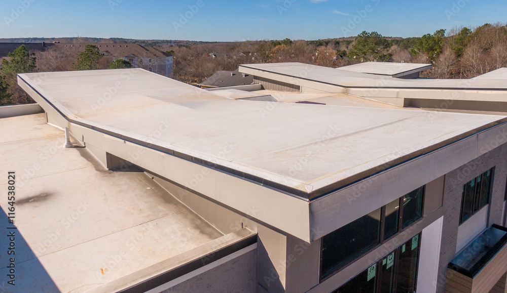 Sunny Day Time Drone Images of New TPO Roofing System on a New Commercial Building in Raleigh North Carolina: No People, Engineering, Architecture, Trades Sunny Day Time Drone Images of New TPO Roofing System on a New Commercial Building in Raleigh North Carolina: No People, Engineering, Architecture, Trades
