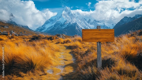 Mountain trail sign indicating direction amidst beautiful alpine landscape du...