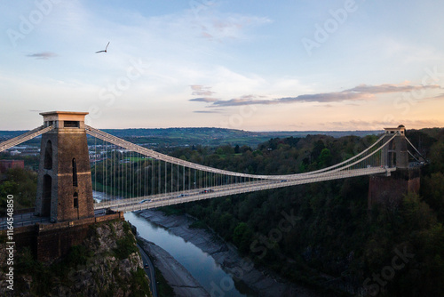 Canvas Print Seagull flying over Bristol Suspension Bridge at sunset