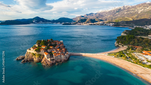 Sveti Stefan, one of Montenegro's most iconic destinations, captured from the drone, showcases its stunning beauty from above. This small islet, connected to the mainland by a narrow causeway photo