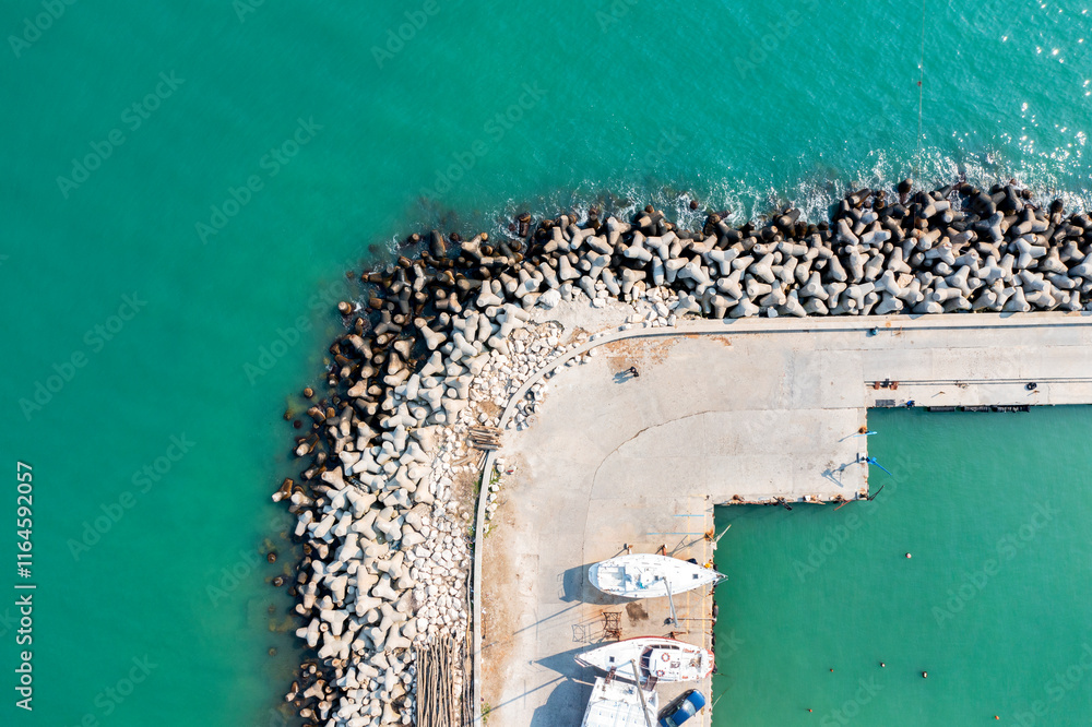 Aerial panoramic view from drone to the breakwater and pier