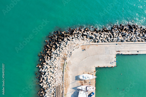 Obraz na płótnie Aerial panoramic view from drone to the breakwater and pier w salonie