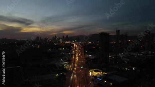 Aerial evening cars traffic, drone shoot evening city landscape