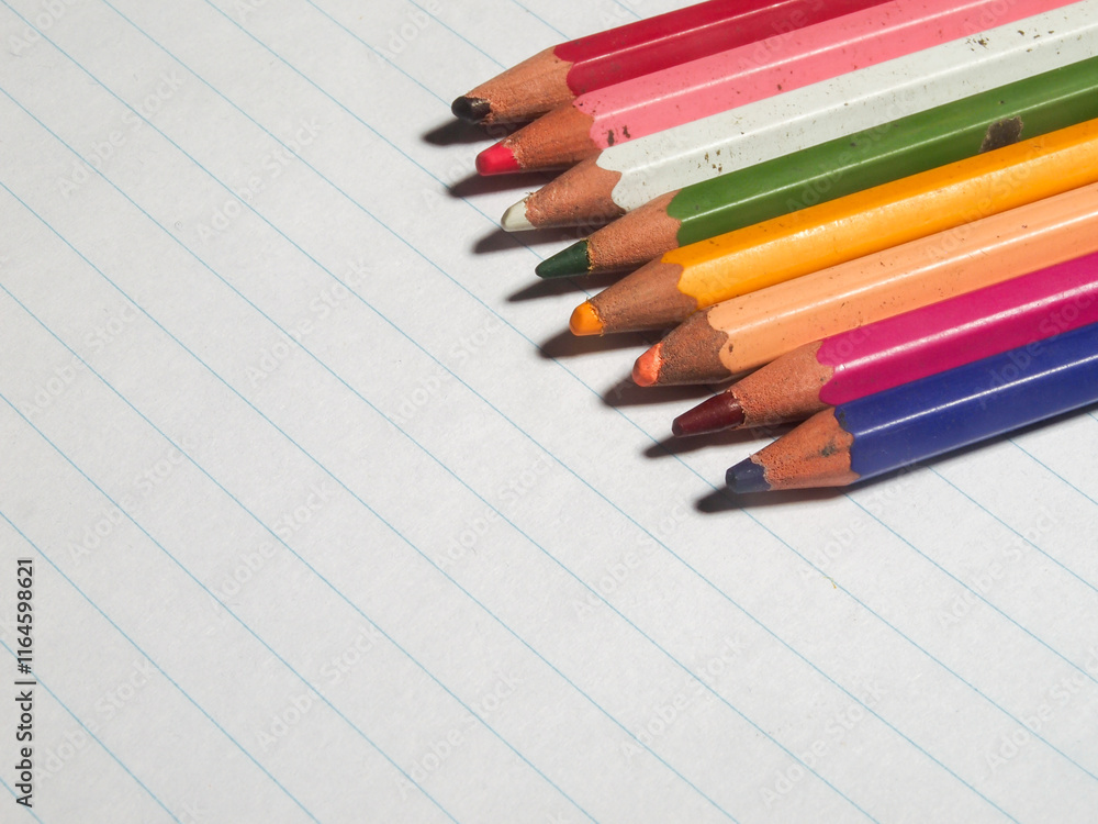 colored pencils on white lined paper. colored pencils on white lined paper.