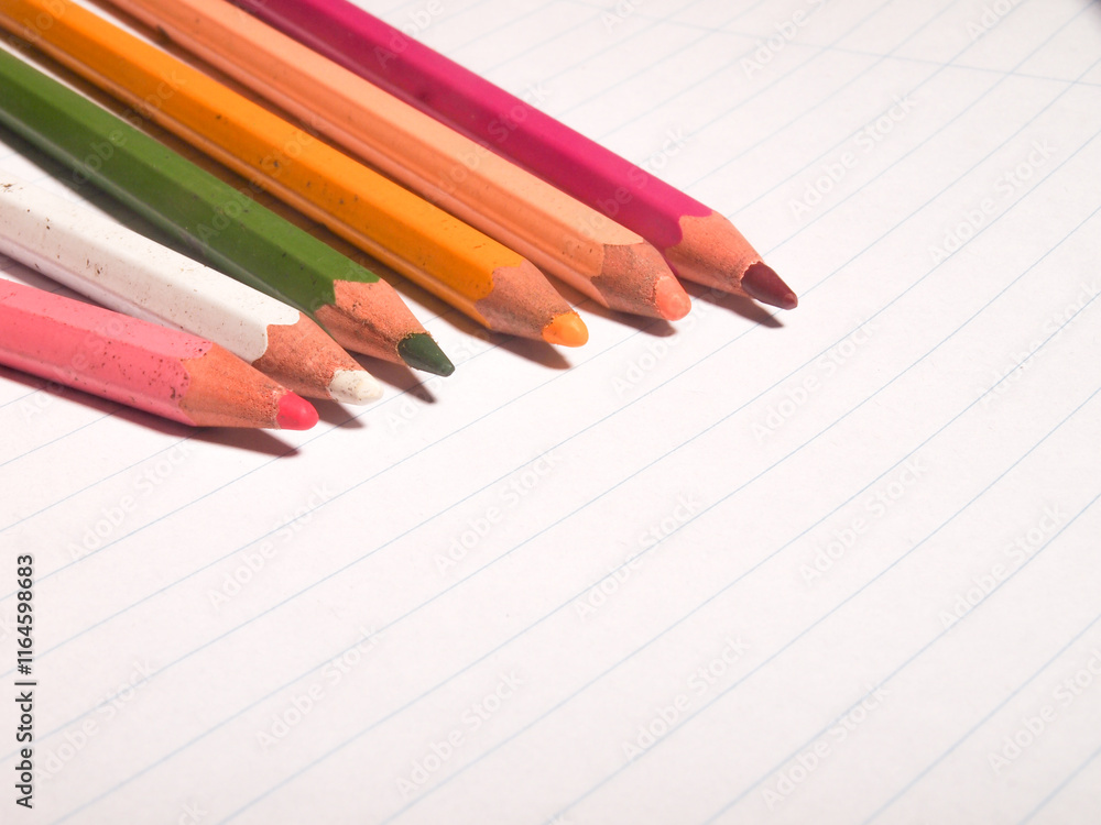 colored pencils on white lined paper. colored pencils on white lined paper.