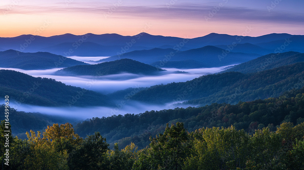 Obraz premium A misty mountain ridge at sunrise, with layers of light and shadow blending seamlessly.