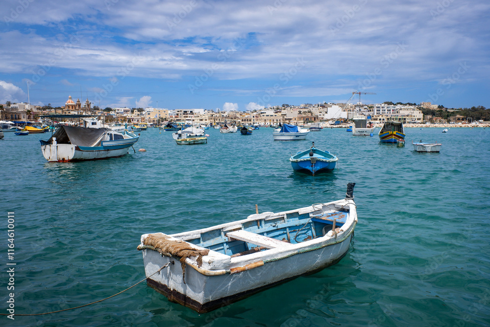 Boats in the harbor in the fishing village of Marsaxlokk on the island of Malta Boats in the harbor in the fishing village of Marsaxlokk on the island of Malta