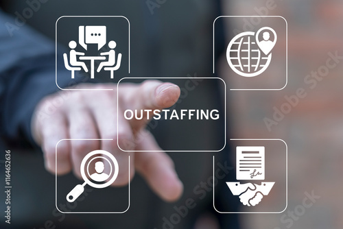 Person using virtual touch screen push word: OUTSTAFFING. Outstaffing business concept for recruitment solution consulting management solving onboarding. Outsourcing or Subcontract Workers Attraction. photo