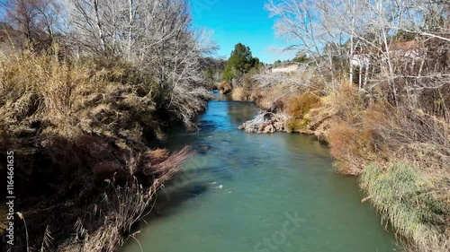 Aerial view of the Cabriel river in winter as it passes through the province of Cuenca, Castilla-La Mancha, Spain with beautiful daylight photo