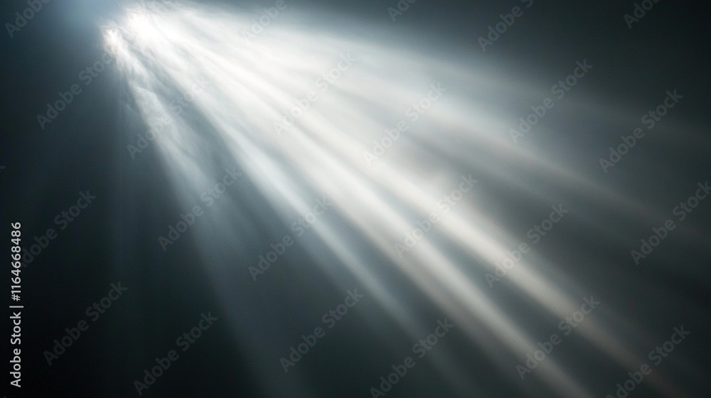 Obraz premium Bright light rays shining through dark smoky atmosphere.