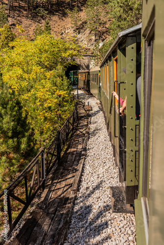 Train entering a tunnel on Sarganska Osmica (Sargan Eight) narrow-gauge heritage railway, Serbia photo