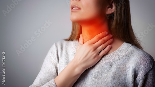 Sore throat, tonsillitis, inflammation. Woman with sore throat, inflamed tonsils from flu symptoms.