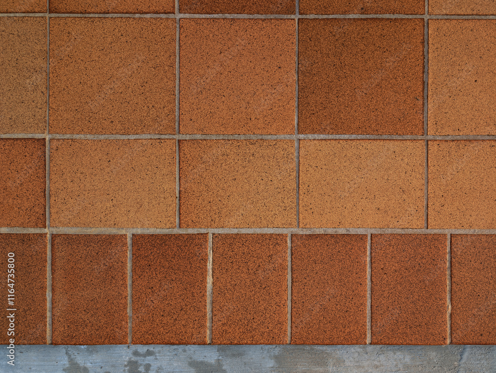 Naklejka premium Top view of reddish brown rustic natural stoneware outdoor floor. Classic rough anti-slip matte terracotta ceramic square tiles, rectangular slab border, paving, terrace, porch, patio, pool exterior.