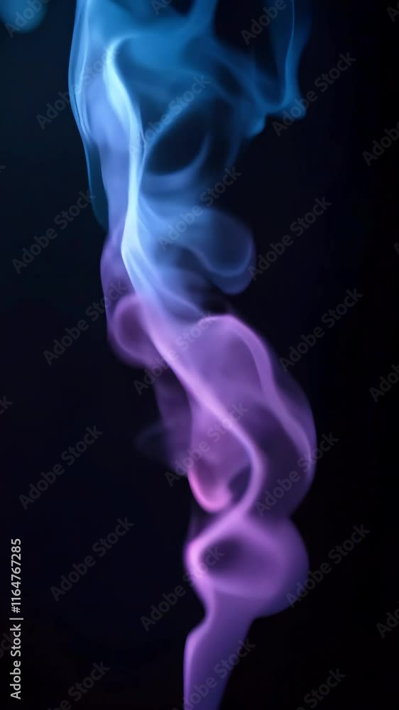 Abstract Smoke Art: A mesmerizing abstract photograph of colorful smoke swirling against a black background. The smoke is a blend of blue and purple, creating a dynamic and ethereal composition. Abstract Smoke Art: A mesmerizing abstract photograph of colorful smoke swirling against a black background. The smoke is a blend of blue and purple, creating a dynamic and ethereal composition.