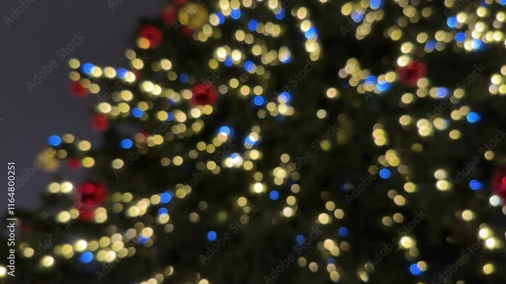 A softly blurred close-up of a Christmas tree shimmering with warm white, blue, and red lights.
Concept of: Festive Christmas bokeh. A softly blurred close-up of a Christmas tree shimmering with warm white, blue, and red lights.
Concept of: Festive Christmas bokeh.