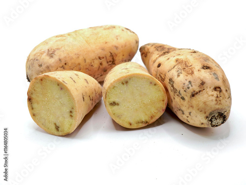 Close up image of Ubi Cilembu, a variety of sweet potato isolated on a clean white background photo