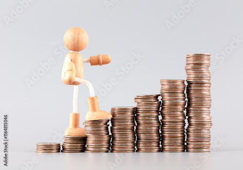 The wooden man goes up and the coins increase