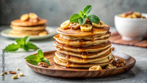 A Delicious Stack of Buttery Pancakes Topped with Bananas, Walnuts, and Sweet Syrup on a Rustic Wooden Plate