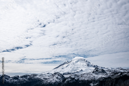 Clearing sky over Mount Baker in lower third of image photo