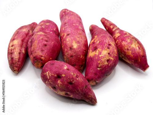 Red-skinned sweet potatoes, also known as red yams or ubi jalar merah isolated on a clean white background photo