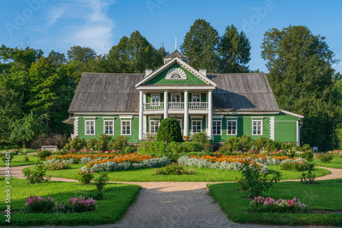 View of the Manor house of Peter Gannibal in the village Petrovskoye on the territory of the Museum-Reserve of A. S. Pushkin on a sunny summer day, Pushkinskiye Gory, Pskov Oblast, Russia photo