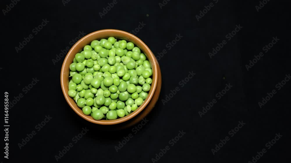 Fresh Green Peas Peeled in ceramic bowl Close-Up on Black Background studio shot Fresh Green Peas Peeled in ceramic bowl Close-Up on Black Background studio shot