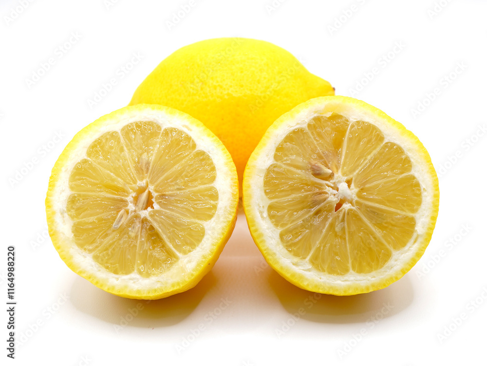 A close-up image of lemon slices isolated on a clean white background. Lemon has sour taste and has a lot of vitamin C A close-up image of lemon slices isolated on a clean white background. Lemon has sour taste and has a lot of vitamin C