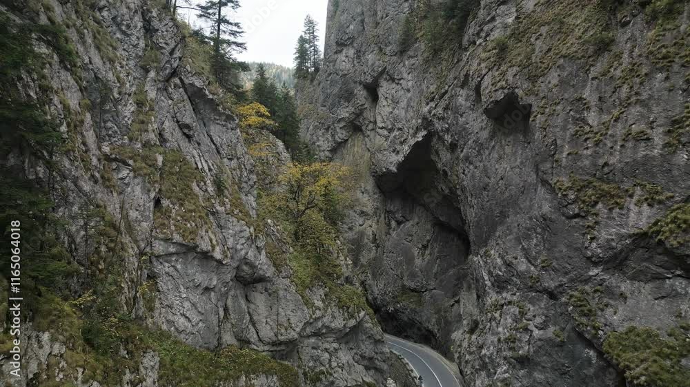 Scenic route passing through the narrow, spectacular Bicaz Gorges. Aerial drone overview Scenic route passing through the narrow, spectacular Bicaz Gorges. Aerial drone overview