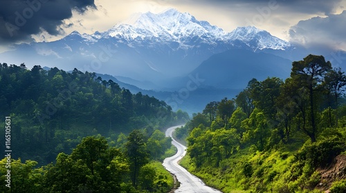 Winding Road Leads to Majestic Snow Capped Mountains