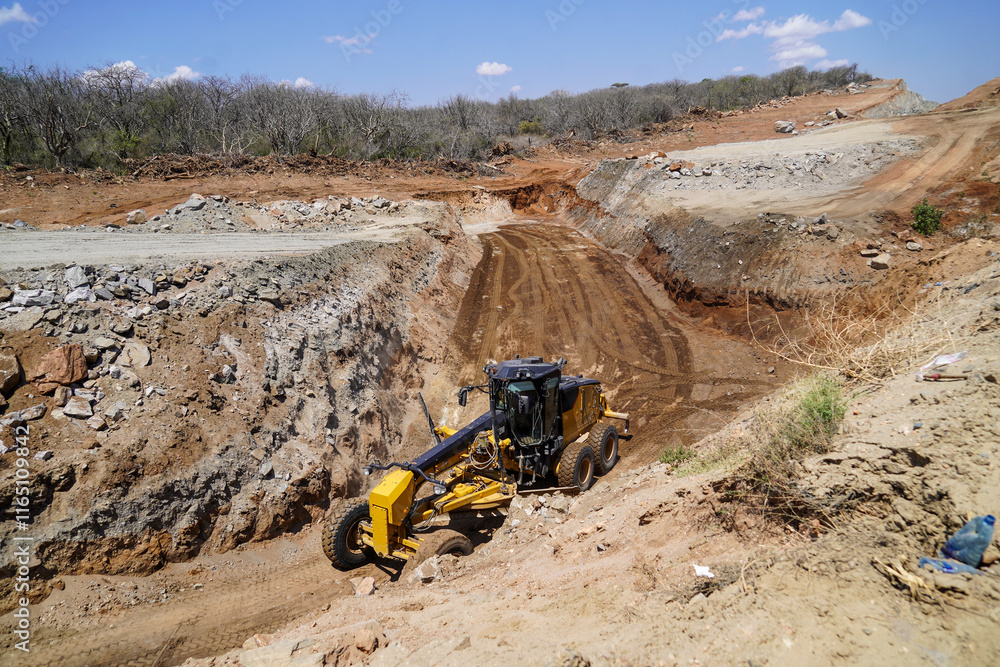 Heavy Duty Grader Leveling Ground at Roadwork Project Heavy Duty Grader Leveling Ground at Roadwork Project
