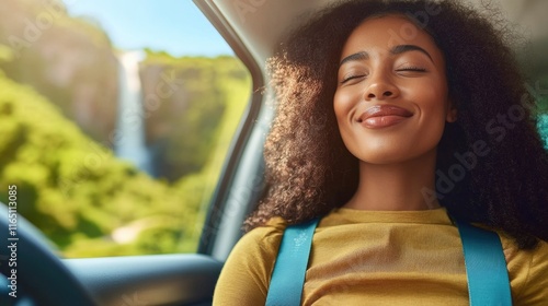 Young african woman enjoying road trip in tropical landscape with waterfalls photo