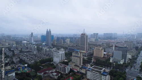 Aerial view of Taizhou Center Telecom Building and Unicom Building in cloudy weather over Taizhou city skyline photo