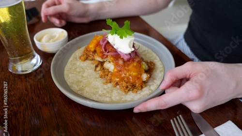 Wallpaper Mural Closeup of freshly prepared fish taco topped with salsa, pickled onions, sour cream and cilantro, served with cold beer on rustic wooden table. Torontodigital.ca